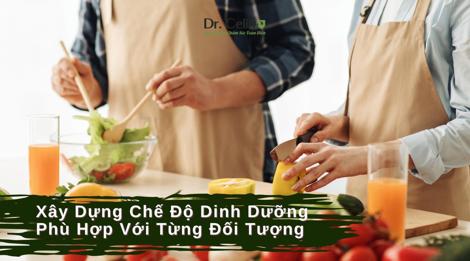 Hai vợ chồng đang đứng ở bếp nấu ăn và trên bàn có nhiều rau củ tươi ngon chuẩn bị cho chế độ dinh dưỡng cân bằng